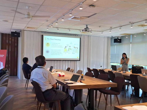 Photo 9. Participants engage in discussion and exchange during the research presentations.Image